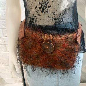 Handmade mohair purse on tooled leather utility belt.